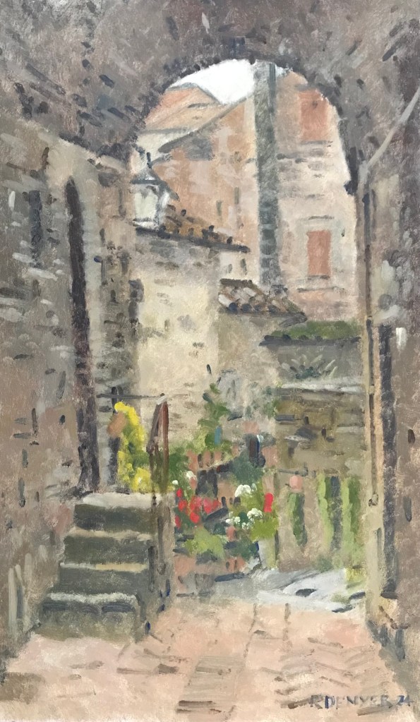 An oil painting of a beautiful loggia in the heart of medieval Anghiari. Painted alla prima in oil paint. The shadow work of the arch is painted thinly for depth, the brushwork is open and lively. The arch of the loggia frames the buildings in the background which are painted in impasto. There are flowers and plants that add a touch of colour to this soft hued painting, made in a traditional oil painting style.

